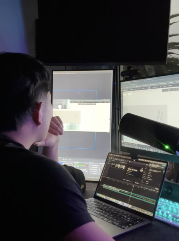 Andy at the desk late at night, charts and screens lit up